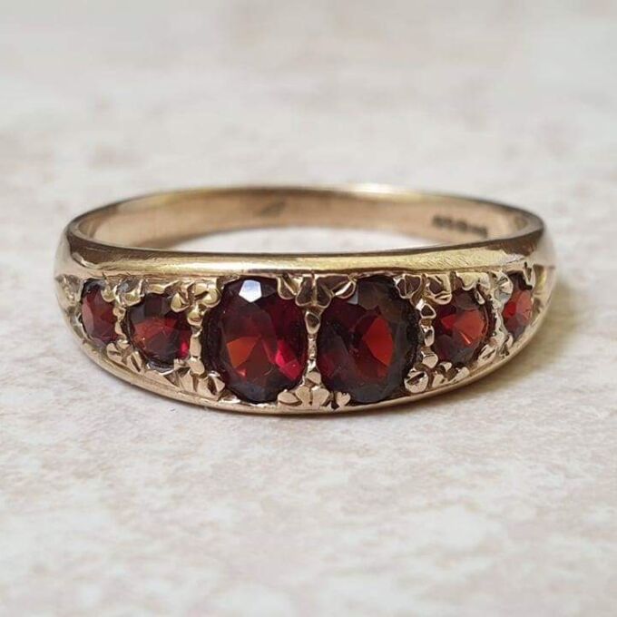 Six Stone Graduating Garnet Band Ring in 9ct Gold, a UK S or a US 9 1/4
