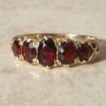 Graduating Five Stone Garnet Ring in 9ct Gold,  a UK N 1/2 or a US almost 7 1/4.