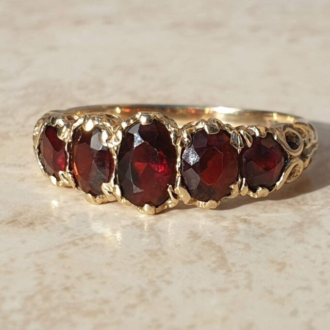 Graduating Five Stone Garnet Ring in 9ct Gold,  a UK N 1/2 or a US almost 7 1/4.