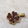 Garnet Four Leaf Clover Pendant in 9ct Gold