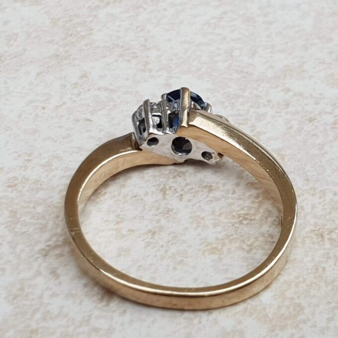 Sapphire and Diamond Trilogy Bypass Ring in 9ct Gold, a UK I 1/2 or a US 4 3/4.