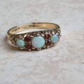 Opal and Garnet Ring in 9ct Gold, a UK N or a US 7