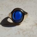 Synthetic Sapphire Cabochon Signet Ring in 9ct Gold, a UK P 1/2 or a US 8.