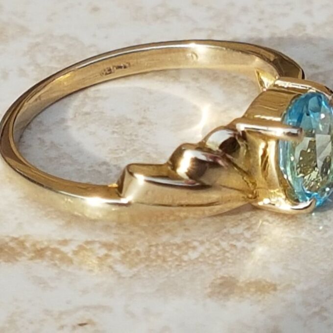 Oval Sky Blue Topaz Solitaire Ring in 9ct Gold, a UK J or a US 5.