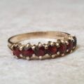 Seven Stone Garnet Band in 9ct Gold, a UK L 1/2 or a US 6