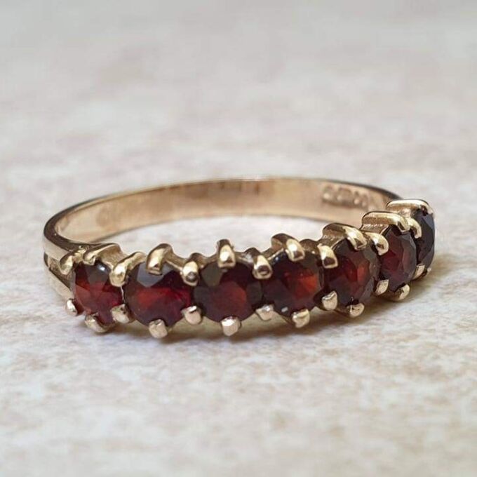 Seven Stone Garnet Band in 9ct Gold, a UK L 1/2 or a US 6