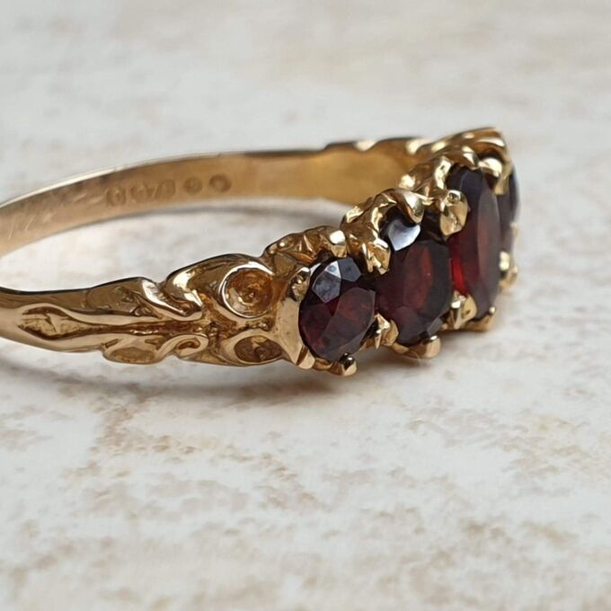 Five Stone Graduating Ring in 9ct Gold,  a UK R or a US 9.