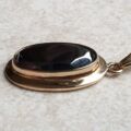 Oval Hematite Pendant in 9ct Gold.