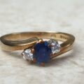 Sapphire and Diamond Trilogy Bypass Ring in 9ct Gold, a UK I 1/2 or a US 4 3/4.