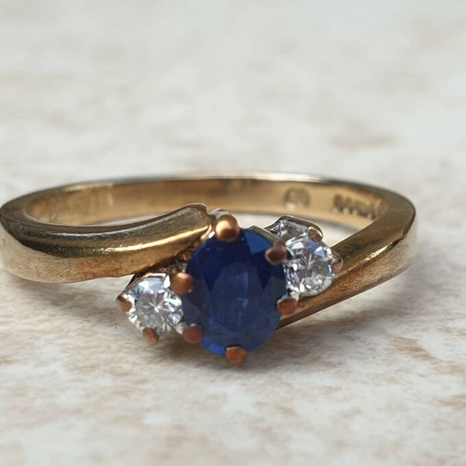 Sapphire and Diamond Trilogy Bypass Ring in 9ct Gold, a UK I 1/2 or a US 4 3/4.
