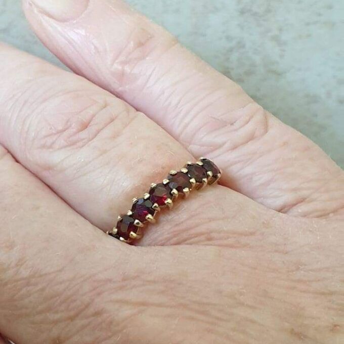 Seven Stone Garnet Band in 9ct Gold, a UK L 1/2 or a US 6