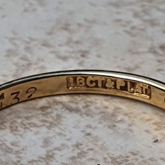 Ruby & Diamond Crossover Ring in 18ct Gold and Platinum.