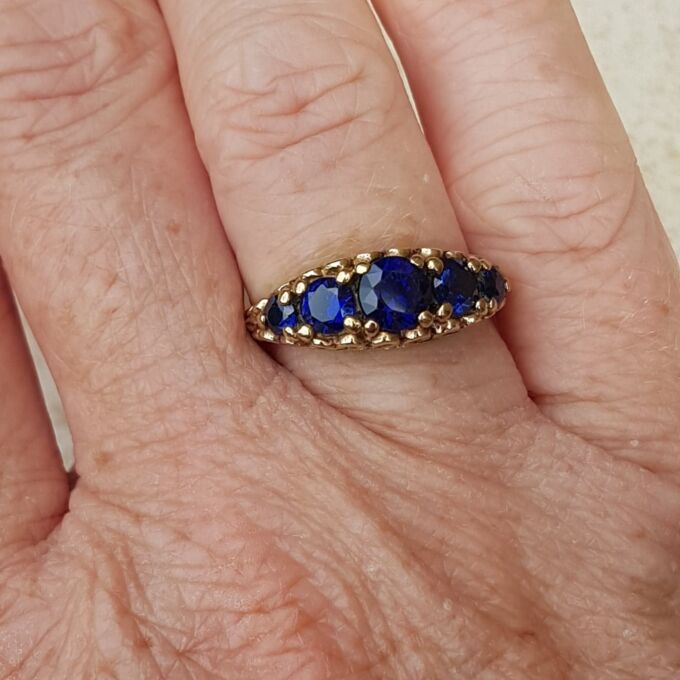 Vibrant Blue Five Stone Synthetic Sapphire Ring in 9ct Gold, a UK N or a US 7.