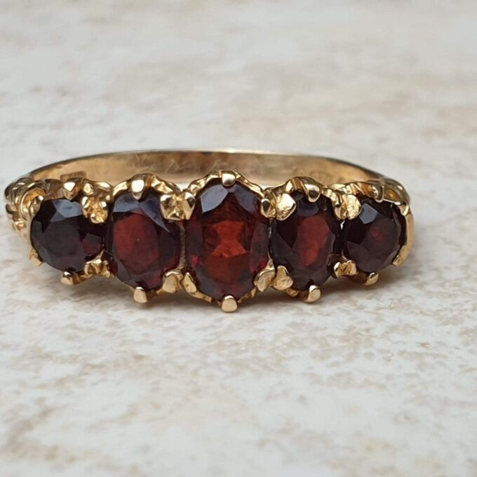 Five Stone Graduating Ring in 9ct Gold,  a UK R or a US 9.