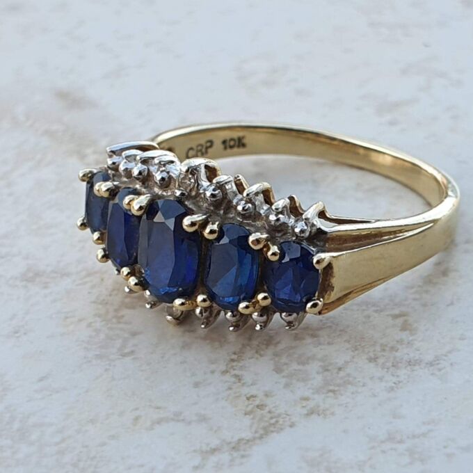 Graduating Synthetic Sapphire Five Stone Ring in 10k Gold.