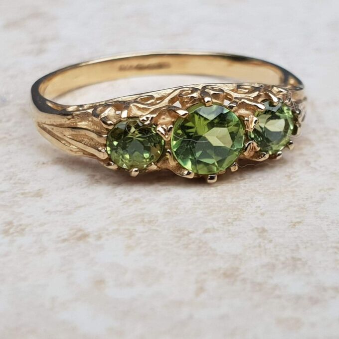 Summery Peridot Three Stone Ring in 9ct Gold, a UK N 1/2 or a US 7 1/4.