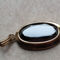 Oval Hematite Pendant in 9ct Gold.