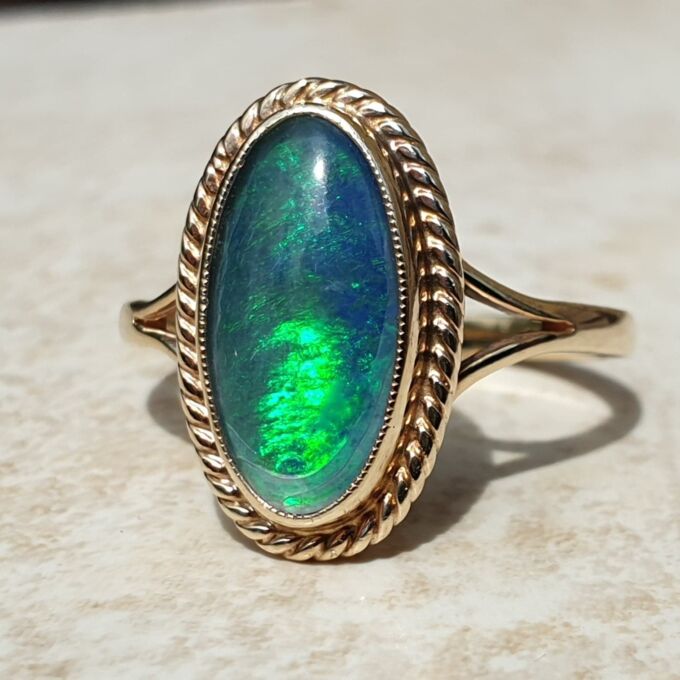Oval Opal Doublet Ring in 9ct gold, a UK O or a US 7 1/2