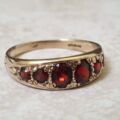Six Stone Graduating Garnet Band Ring in 9ct Gold, a UK S or a US 9 1/4
