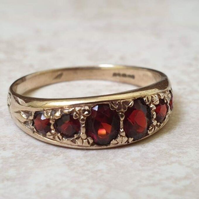 Six Stone Graduating Garnet Band Ring in 9ct Gold, a UK S or a US 9 1/4