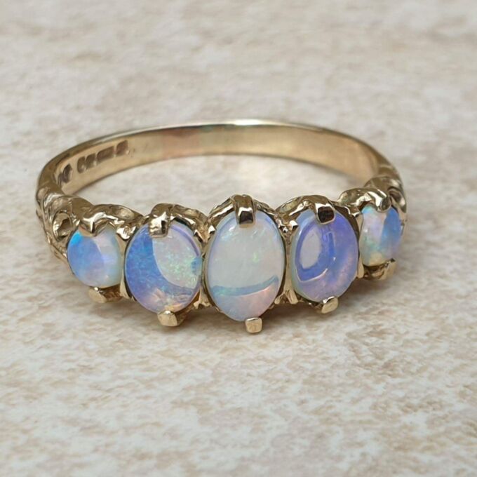 Graduating Five Stone Opal Ring in 9ct Gold,  a UK O or a US 7 3/4.