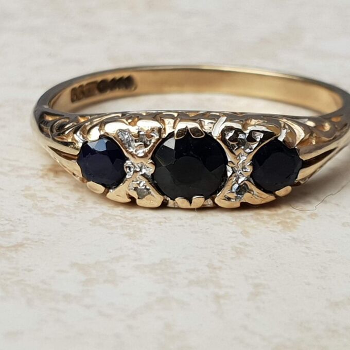 Three Stone Sapphire Ring with Diamonds in 9ct Gold, a UK O 1/2 or a US 7 1/2.