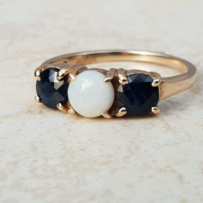 Opal and Sapphire Trilogy Ring in 9ct Gold, a UK J 1/2 or a US 5 1/4.