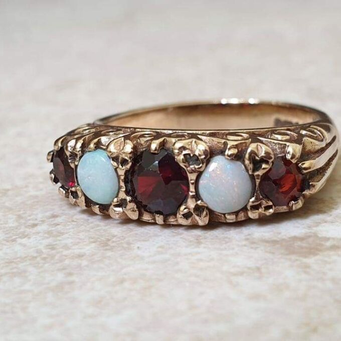 Five Stone Opal and Garnet 9ct Gold Ring, a UK K 1/2 or a US size 5 3/4.