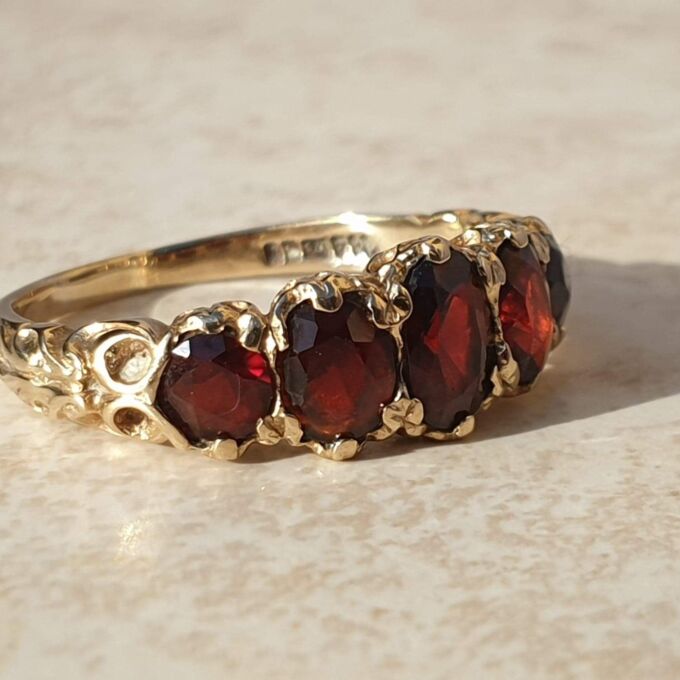 Graduating Five Stone Garnet Ring in 9ct Gold,  a UK N 1/2 or a US almost 7 1/4.