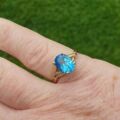 Oval Swiss Blue Topaz Ring in 10K Gold.