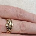 Four piece Puzzle Ring in 9ct Gold,  a UK P 1/2 or a US 8.