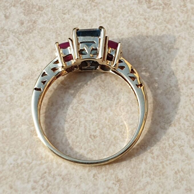 Topaz and Synthetic Ruby Trilogy Ring in 9ct Gold.