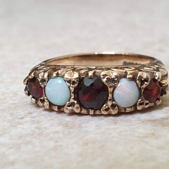 Five Stone Opal and Garnet 9ct Gold Ring, a UK K 1/2 or a US size 5 3/4.