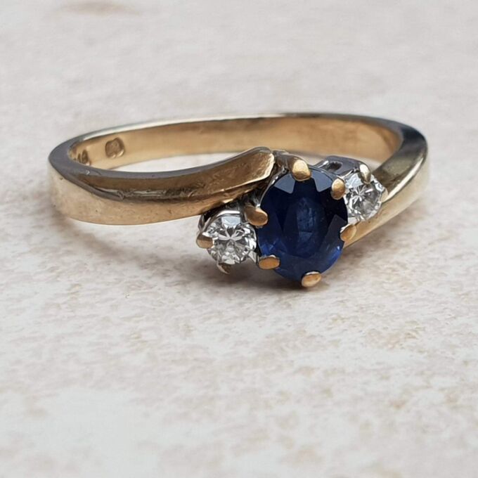Sapphire and Diamond Trilogy Bypass Ring in 9ct Gold, a UK I 1/2 or a US 4 3/4.