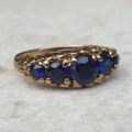 Vibrant Blue Five Stone Synthetic Sapphire Ring in 9ct Gold, a UK N or a US 7.