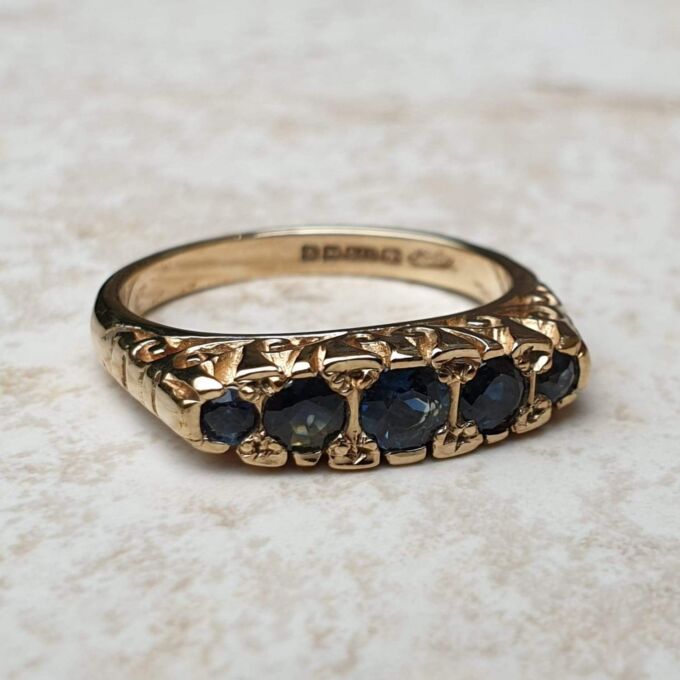 Blue Sapphire Five Stone Ring in 9ct Yellow Gold, a UK K 1/2 or a US 5 3/4.