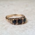 Three Stone Dark Blue Sapphire Ring in 9ct Gold