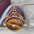 Onyx and Tigers Eye Spinning Pendant in 9ct Gold
