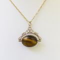 Onyx and Tigers Eye Spinning Pendant in 9ct Gold