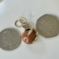 Eagle or Dragon Claw Pendant with Goldstone Ball in 9ct Gold